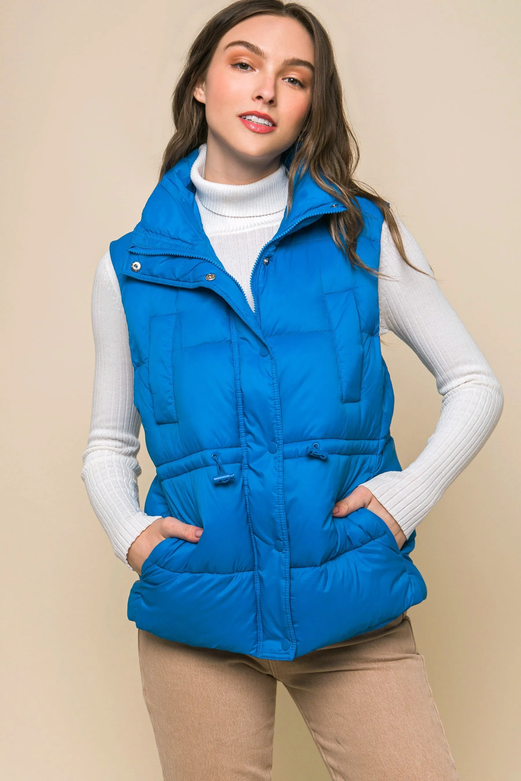 Women's Color Zip up button puffer vest with waist toggles